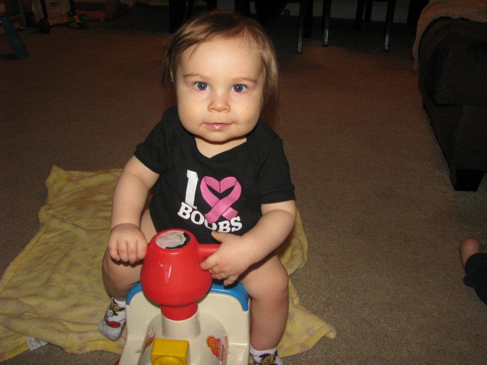 Adam in I Heart Boobs Onesie